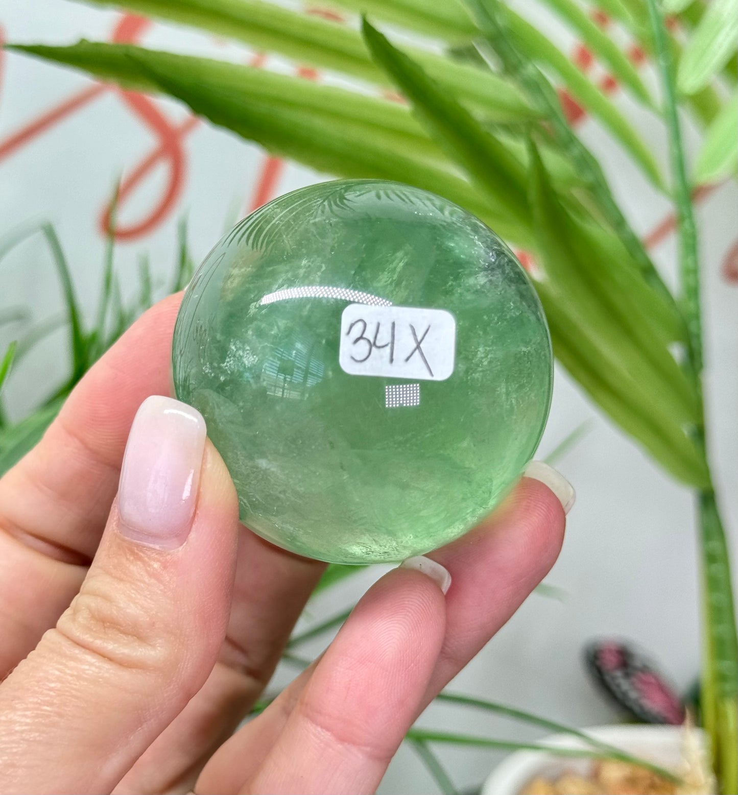 Green fluorite sphere. 37mm and will include a sphere stand. * see attached photos for back lighting