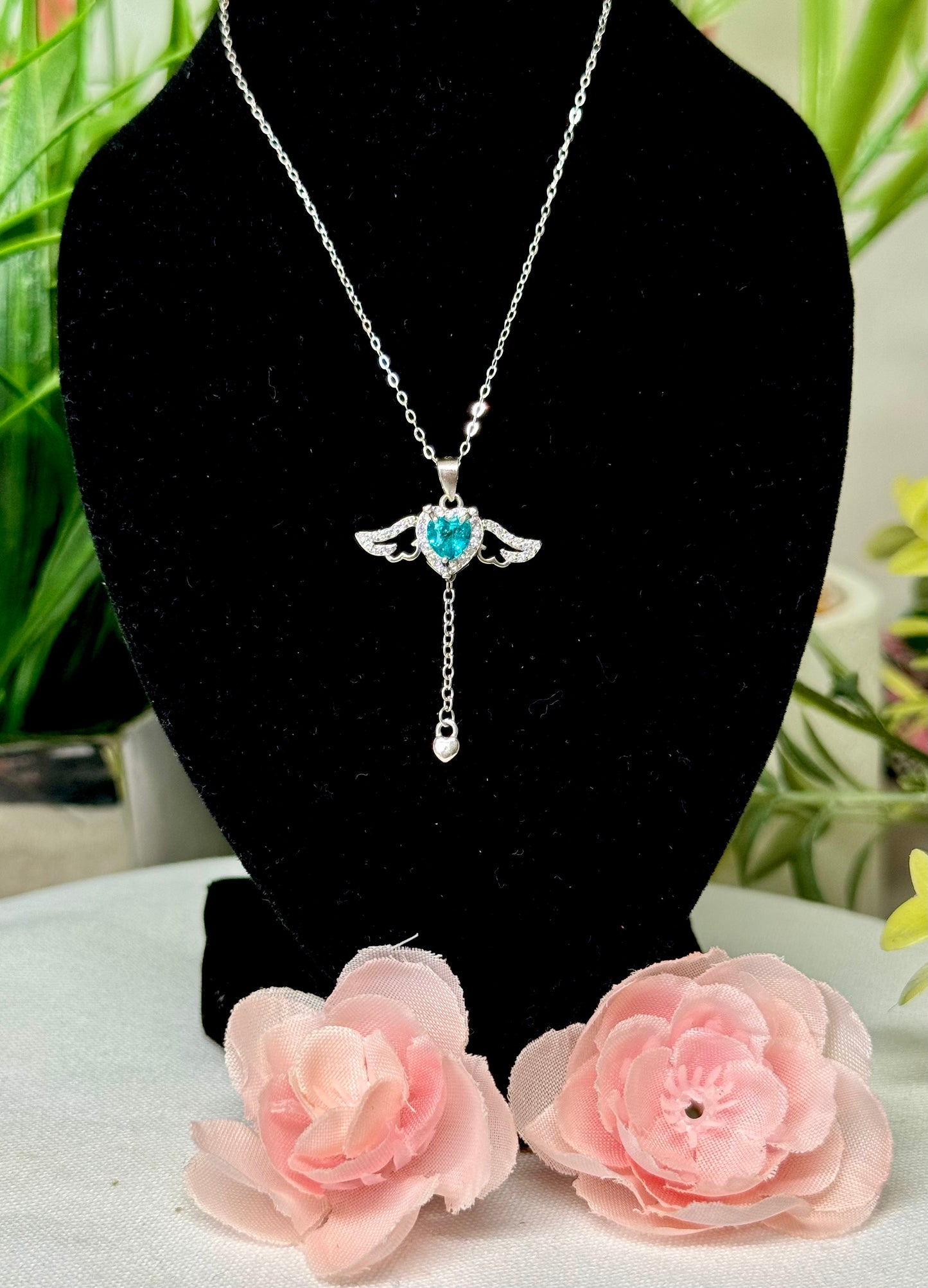 Blue topaz (moveable) wings necklace. S925 sterling silver and 18” chain. See attached video