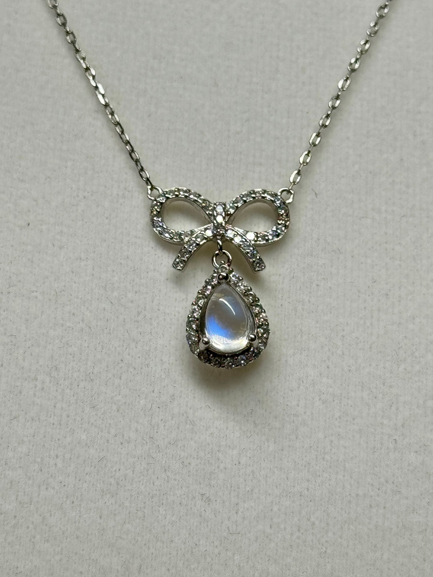 Moonstone bow necklace. S925 sterling silver. 17-18” adjustable chain