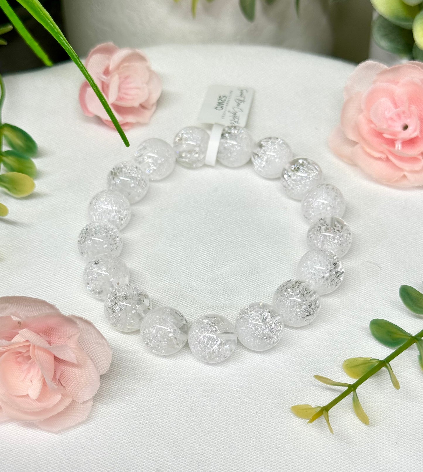 White quenched quartz. See photos for detailed view. 12.2mm beads and fits wrist size 7.25”