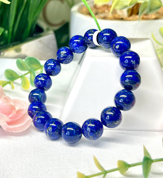 HQ lapis lazuli with pyrite inclusions. 11.7 mm beads and fits wrist size 7”*