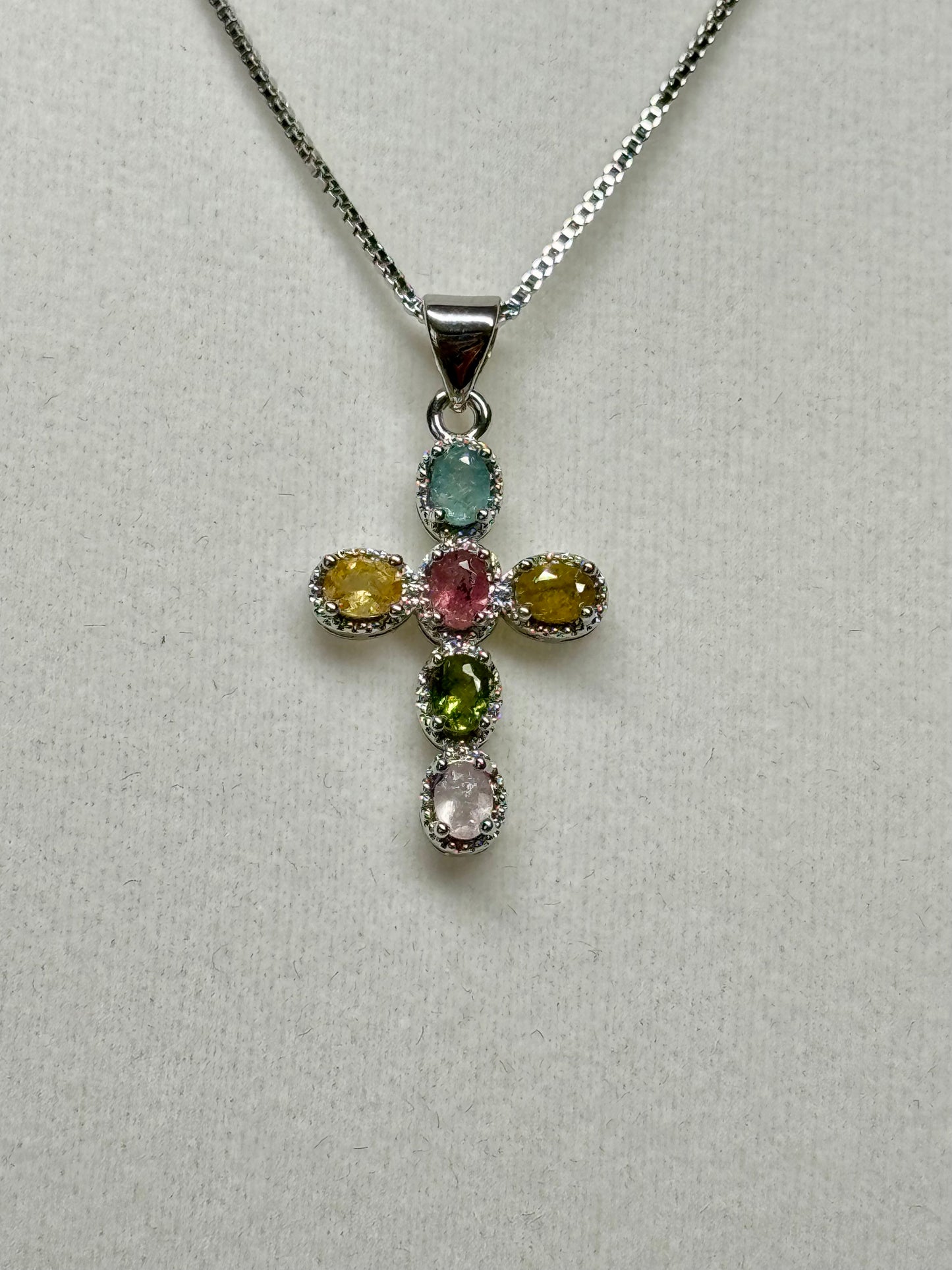 Rainbow tourmaline cross necklace. S925 plated copper with 18” and under adjustable chain