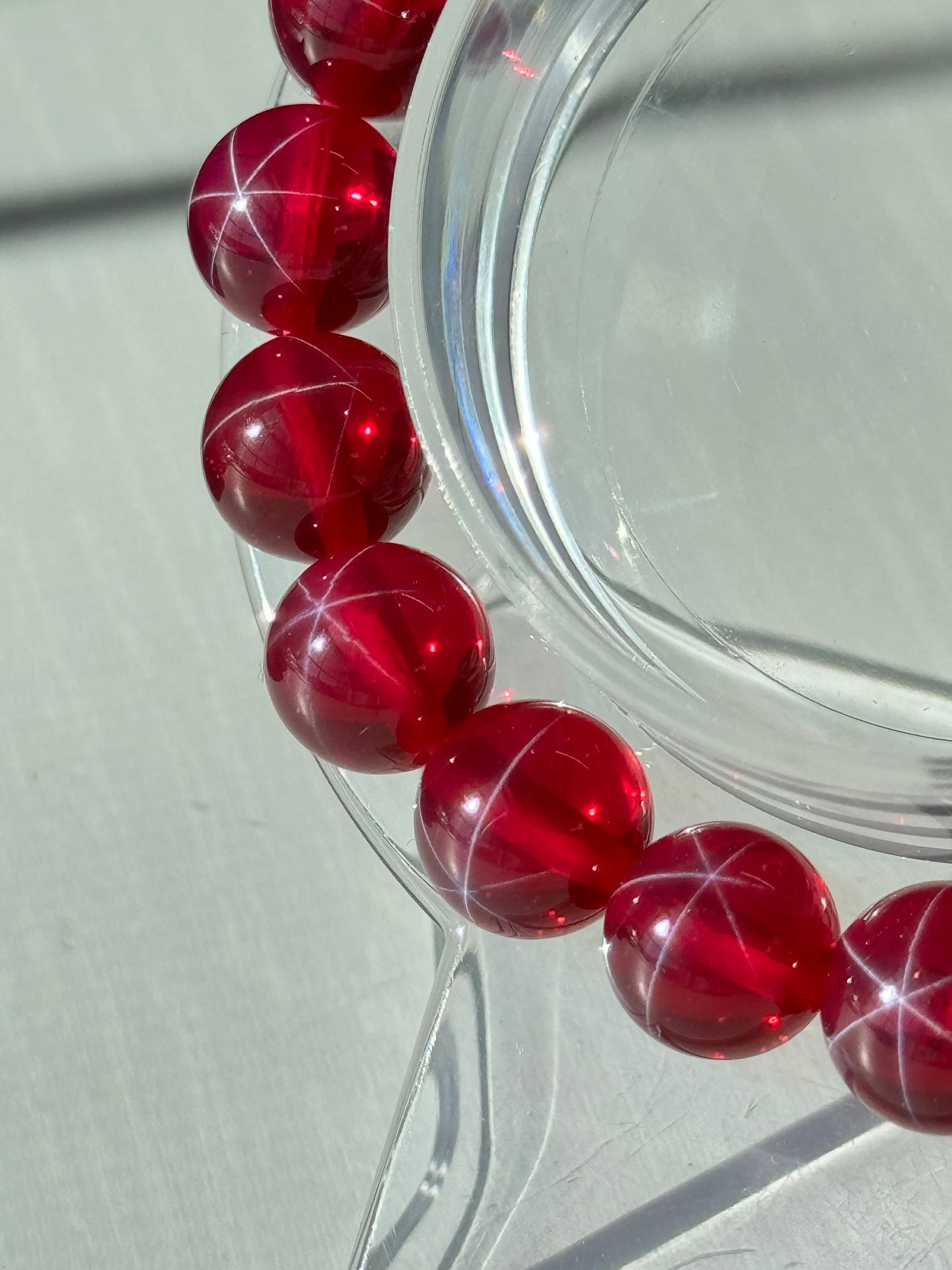 Lab created 6 star point Ruby bracelets. 10mm and 6mm available. Please select bead size from options