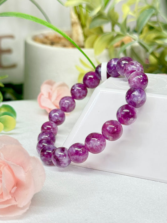 Purple Muscovite bracelet. 10.2 mm beads and fits a size 7” wrist. See photos for details.