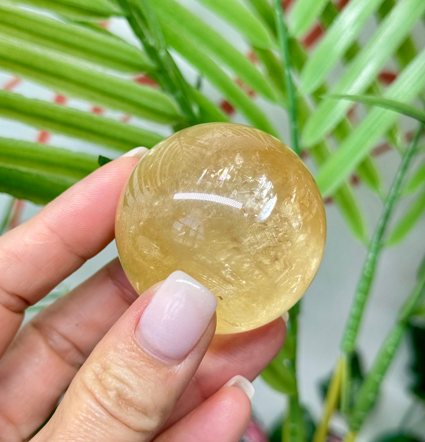 Honey calcite sphere. 44.5mm includes a spheres stand