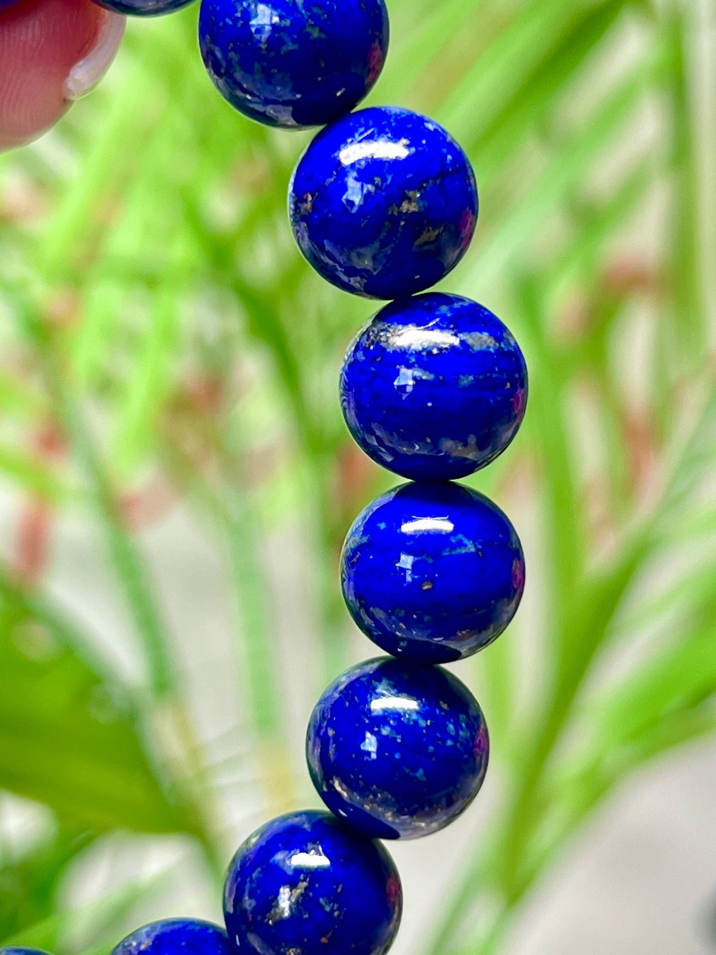 HQ lapis lazuli with pyrite inclusions. 11.7 mm beads and fits wrist size 7”*