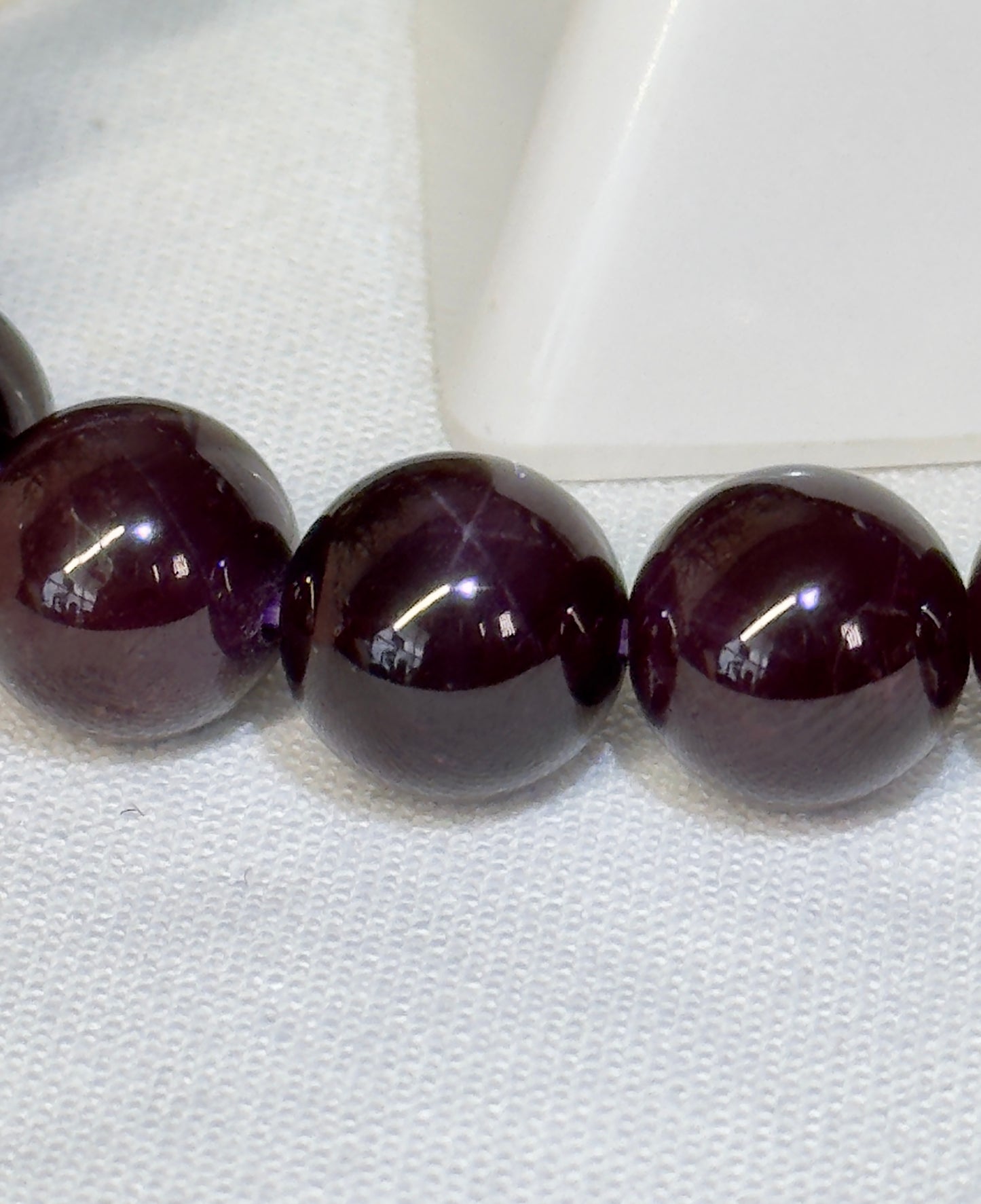 High quality star garnet. See attached video for view of star flash. 11mm and fits a size 7” wrist, can be resized.