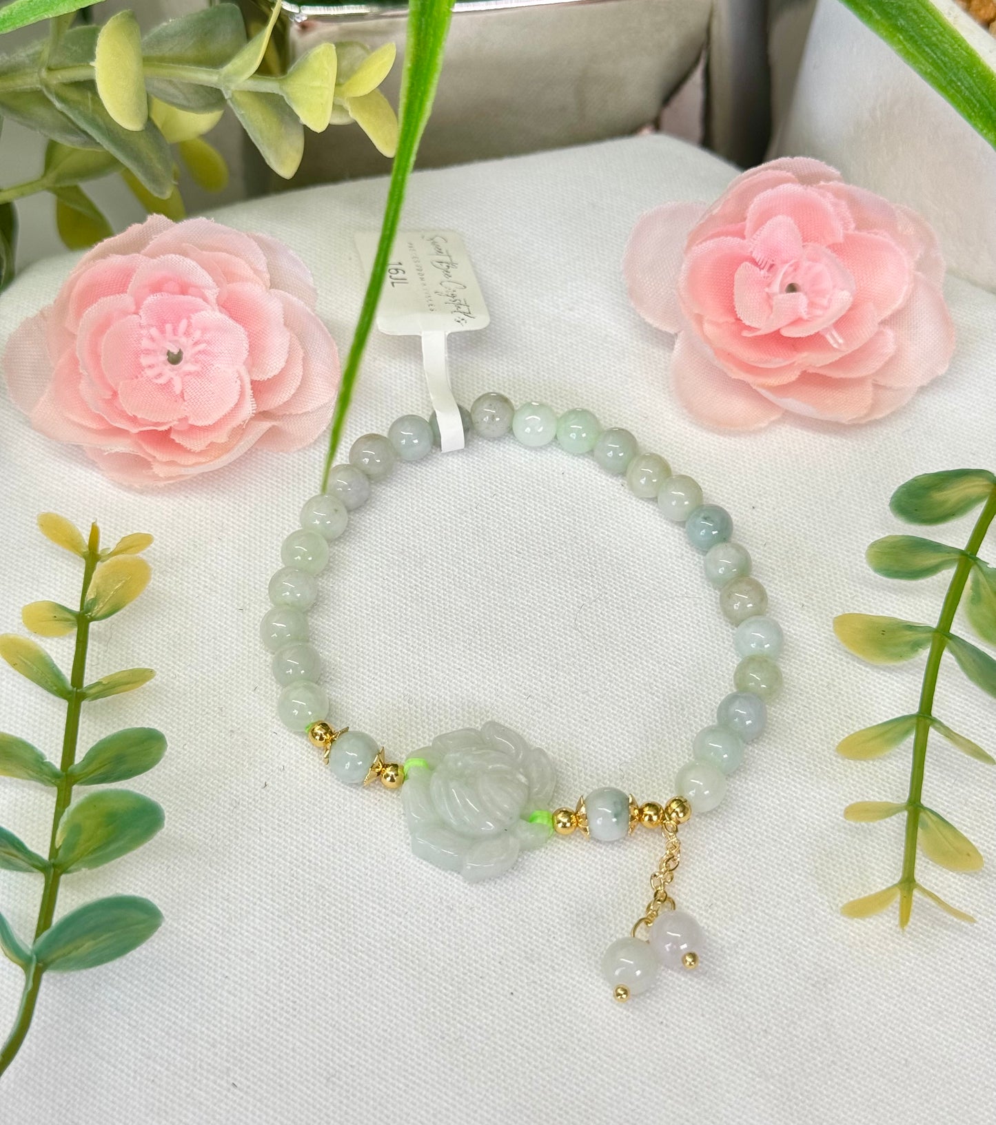 Jade design bracelet with lotus and gold detailing. 6mm beads. Fits wrist size 6.5”. Can be resized, see description