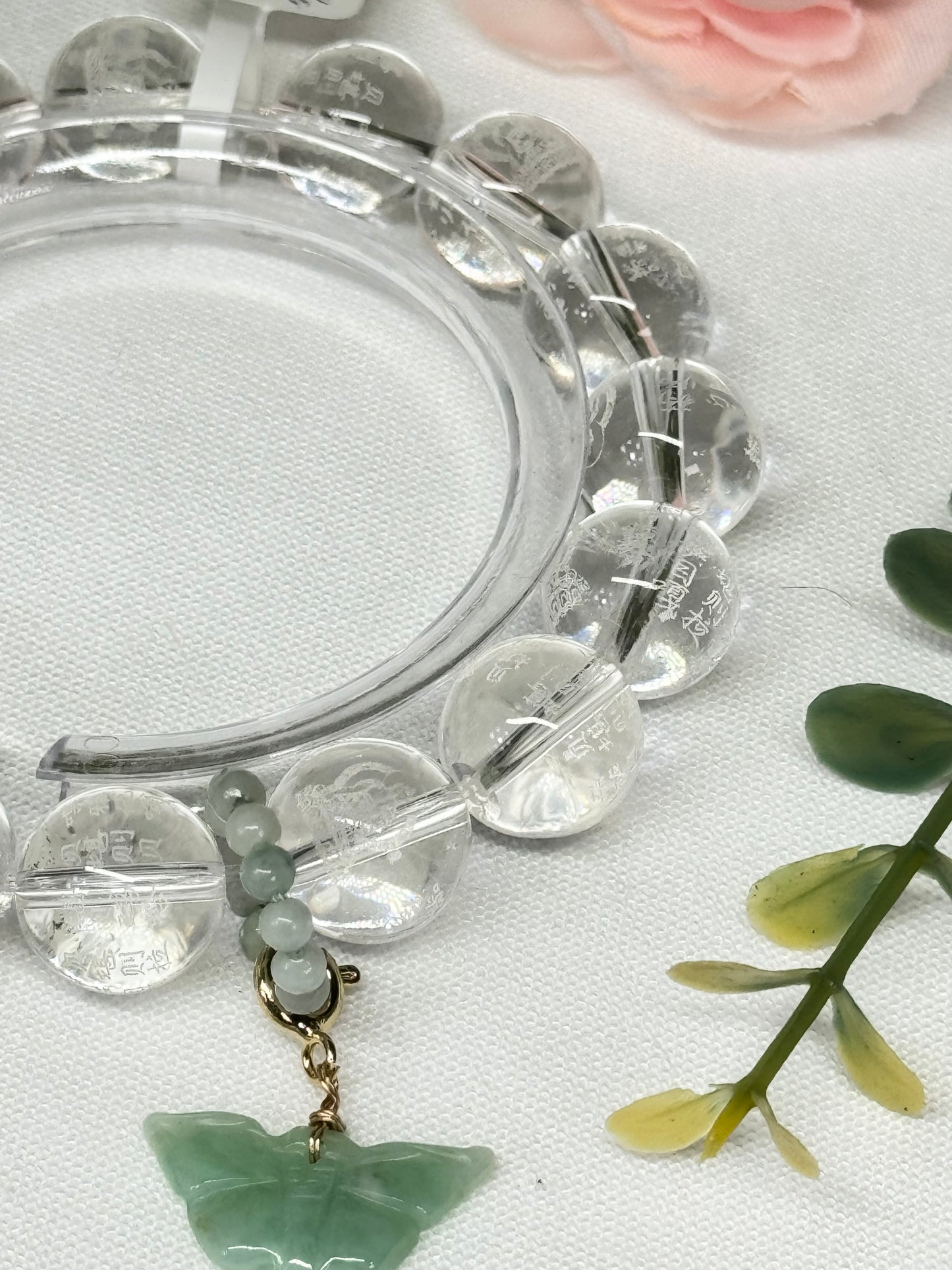 Clear Quartz with removable jade butterfly charm and statement bead. Beads are etched with Chinese lettering and Buddha. See photos for details.