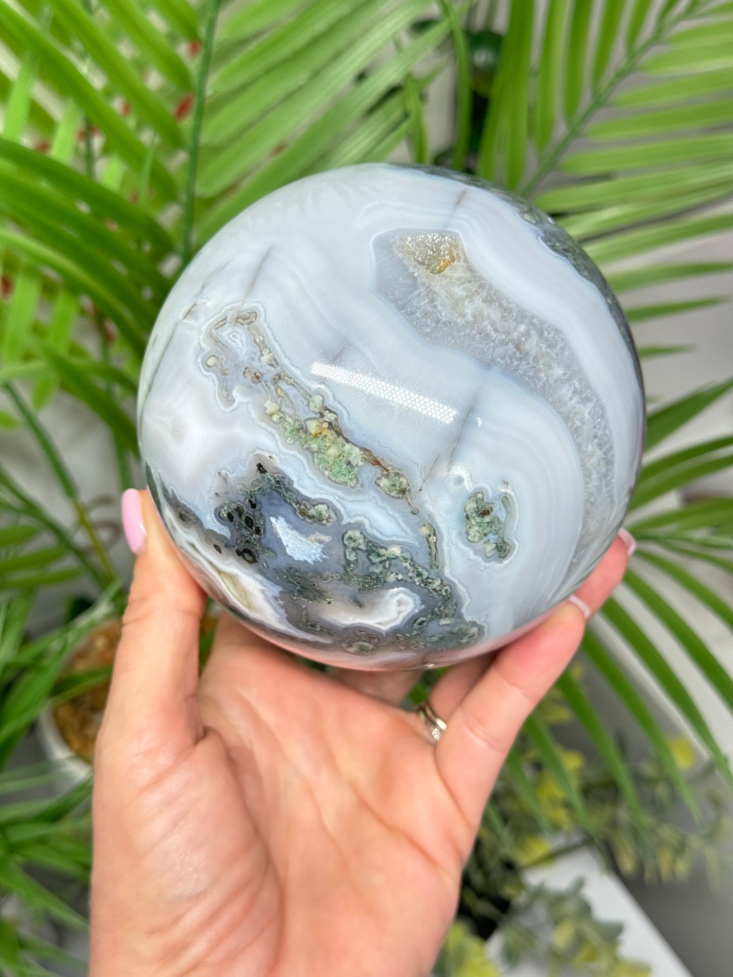 XXL moss agate sphere. 108mm and weighs 4lbs. Includes free sphere stand