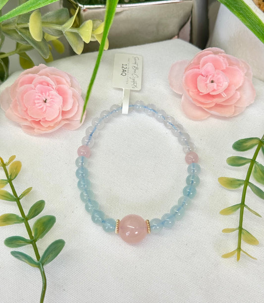 Rose Quartz, aquamarine and moonstone design bracelet. 5mm and 11mm center bead. Fits wrist size 7”. Can be resized, please see description