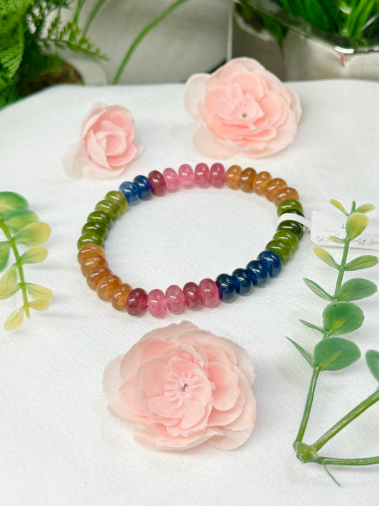 Rainbow tourmaline *color enhanced bracelet with donut style beads fits wrist size 7”