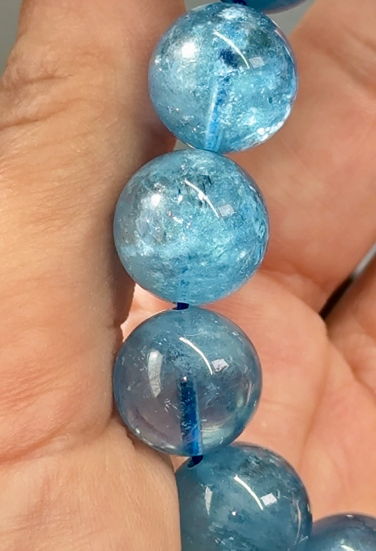 HQ aquamarine bracelet. With asterisms and chatoyancy. Deep blue color and fabulous! Please see all pics for details. 13.6mm beads and fits wrist size 7” can be downsized