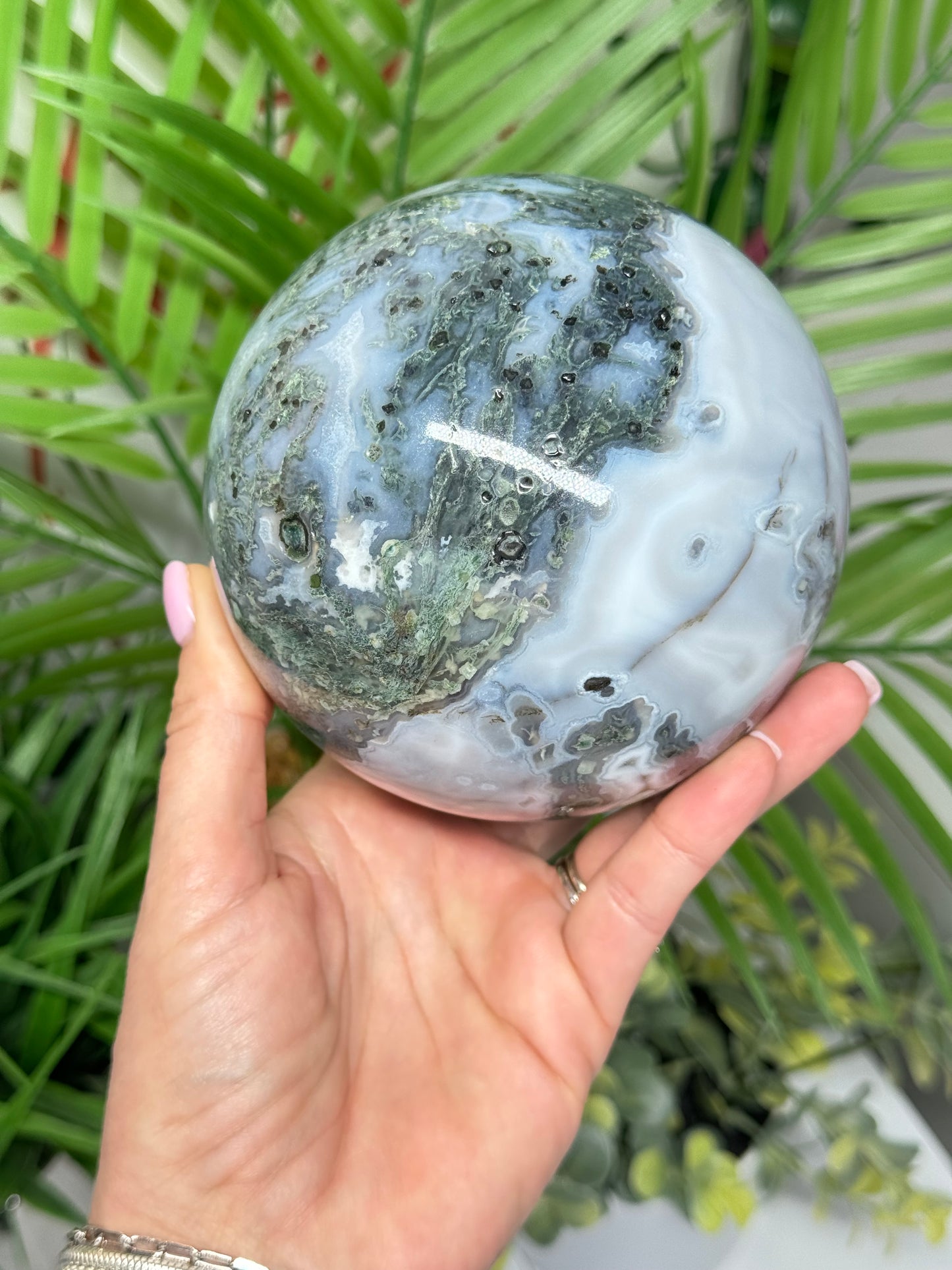 XXL moss agate sphere. 108mm and weighs 4lbs. Includes free sphere stand