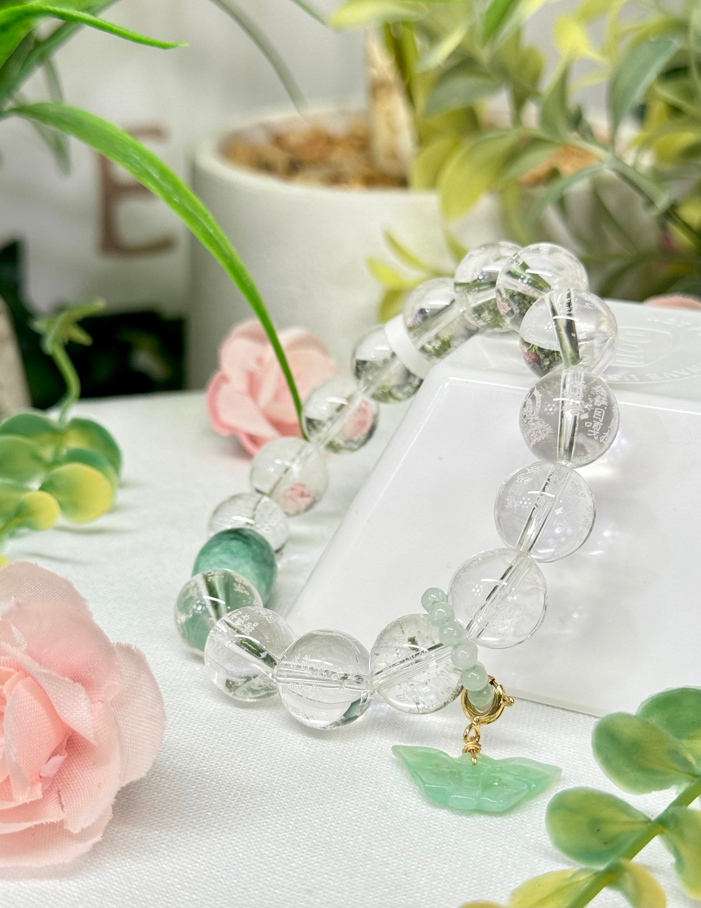 Clear Quartz with removable jade butterfly charm and statement bead. Beads are etched with Chinese lettering and Buddha. See photos for details.