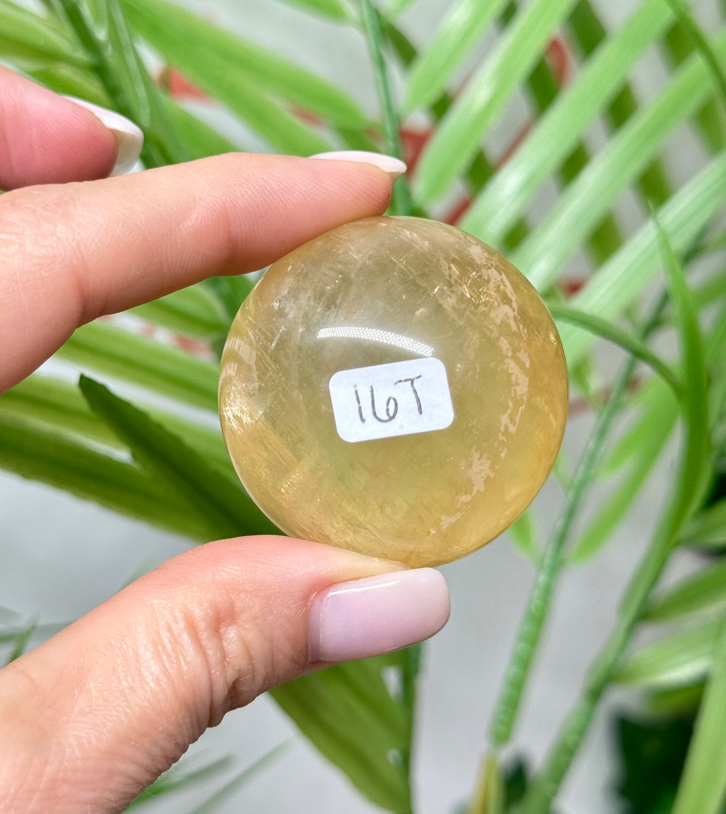 Honey calcite sphere. 42mm includes a sphere stand