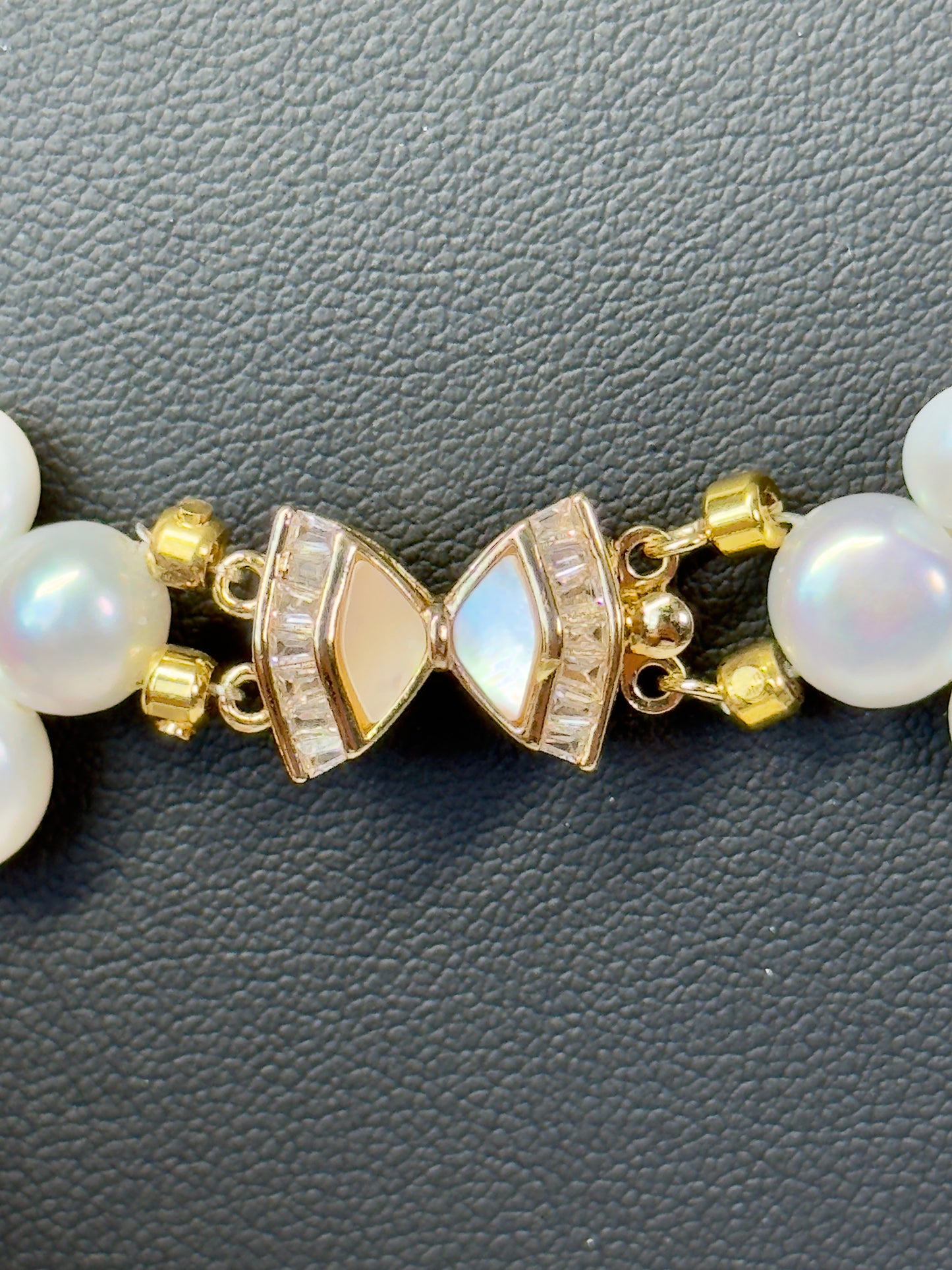 Gorgeous freshwater pearl statement necklace with 3 rows of pearls and beautiful butterfly closure. Size 17”