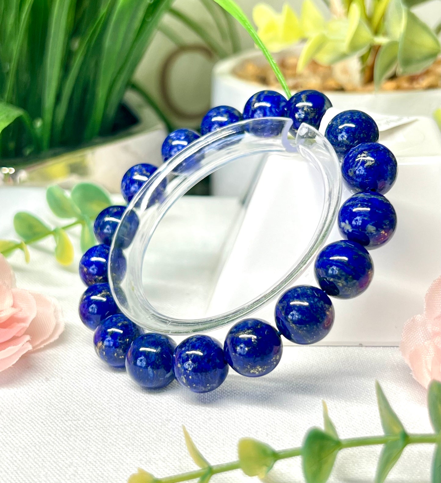 HQ lapis lazuli with pyrite inclusions. 11.7 mm beads and fits wrist size 7”*