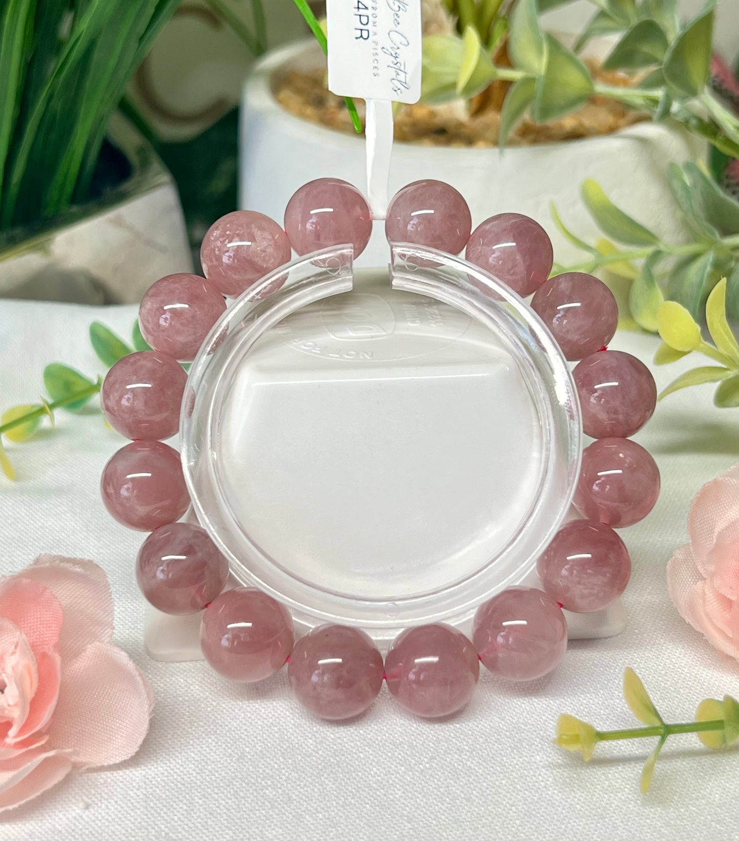 HQ purple rose Quartz with asterisms. 13.1 mm beads and fits wrist size 7”*