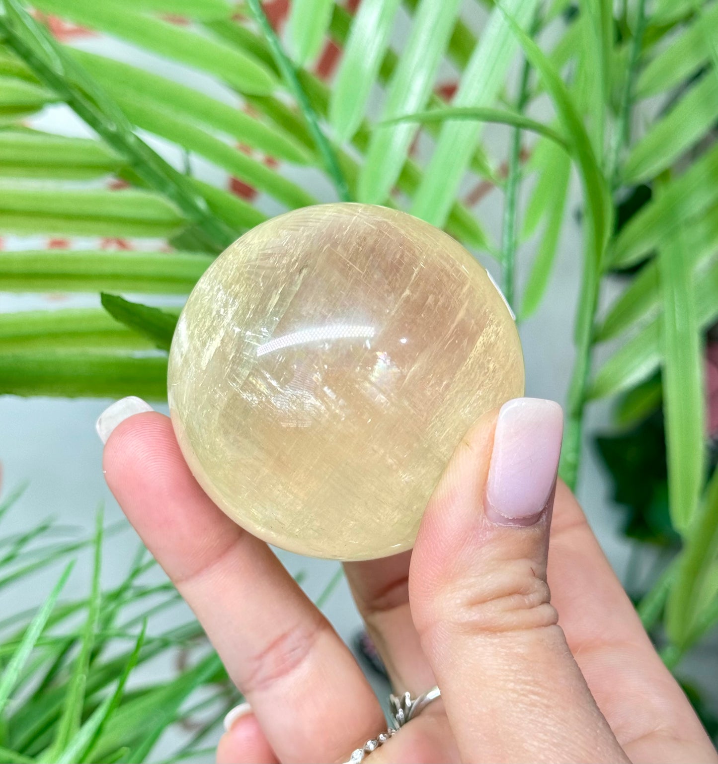 Honey calcite sphere. 52.5mm will include a sphere stand