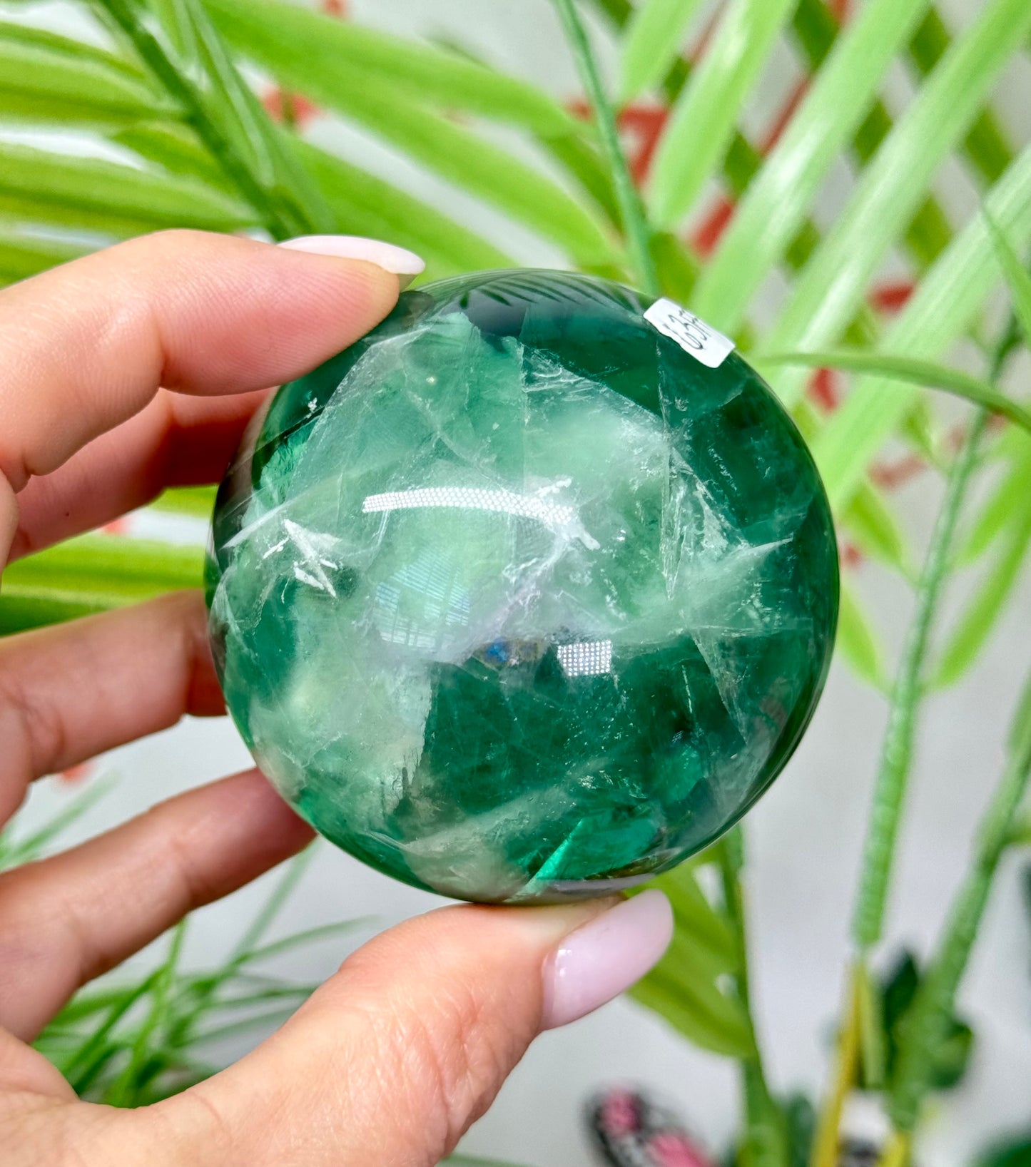 Large feather fluorite sphere. 60mm and will include a sphere stand. *see attached photos for back lighting