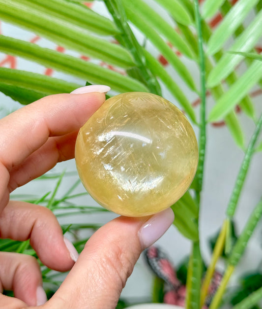 Honey calcite sphere. 42mm includes a sphere stand