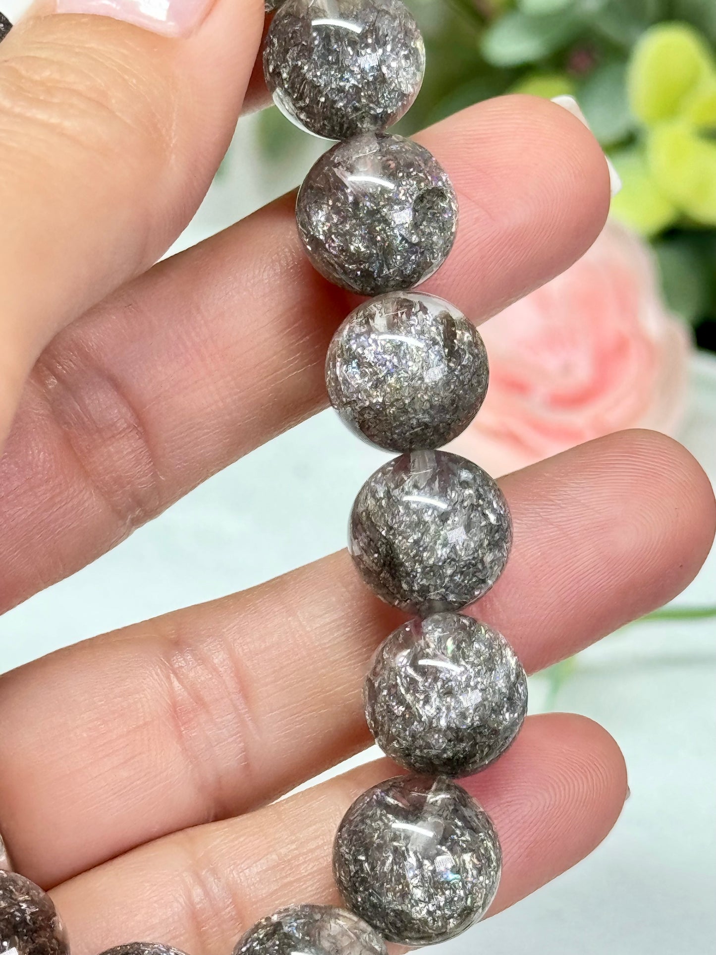 Silver quenched quartz bracelet. See photos for detailed view. *color enhanced. 12mm beads and fits wrist size 7”