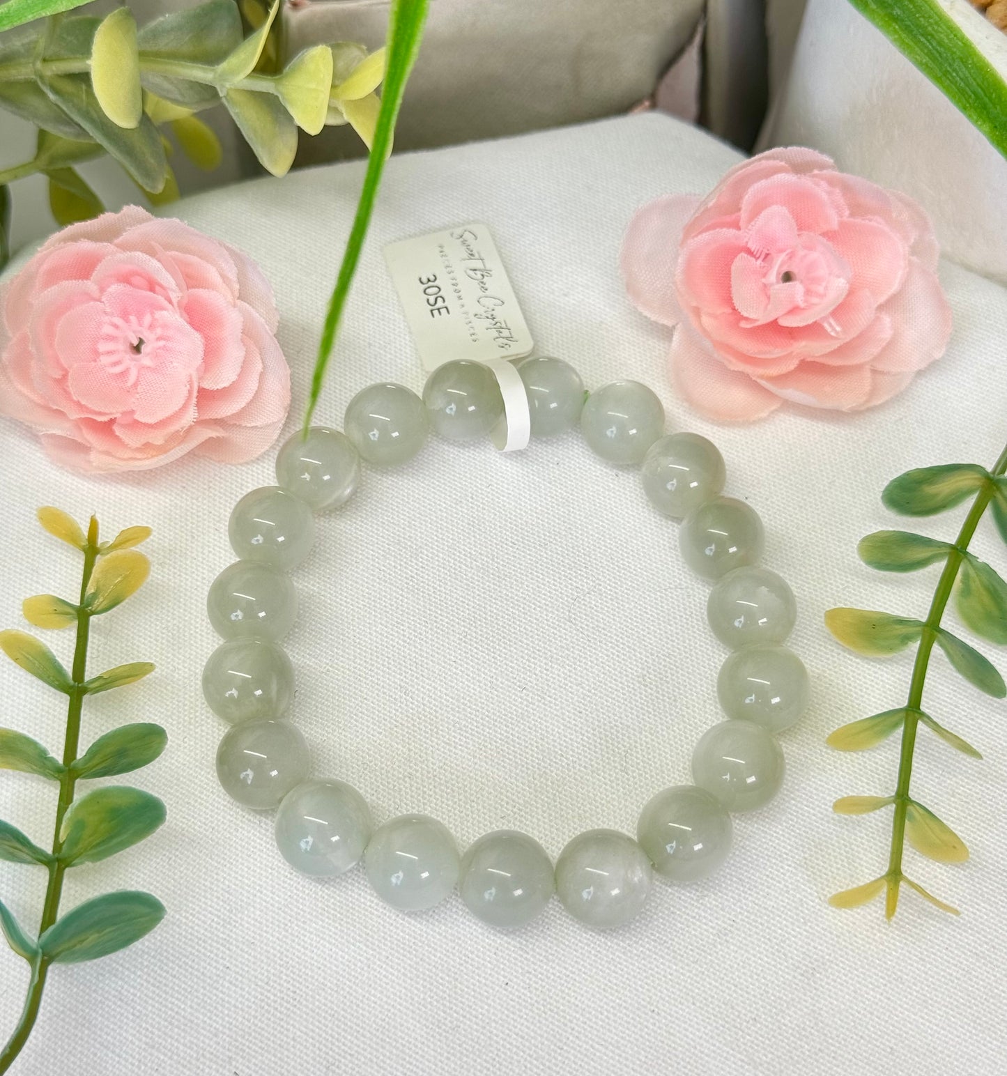 Sage green moonstone bracelet. 10 and 8mm beads. Fits wrist size 7”. Can be resized, please see description and select bead size