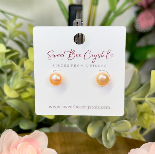 Peach toned freshwater pearl studs with silicon backs. S925 plated stainless steel