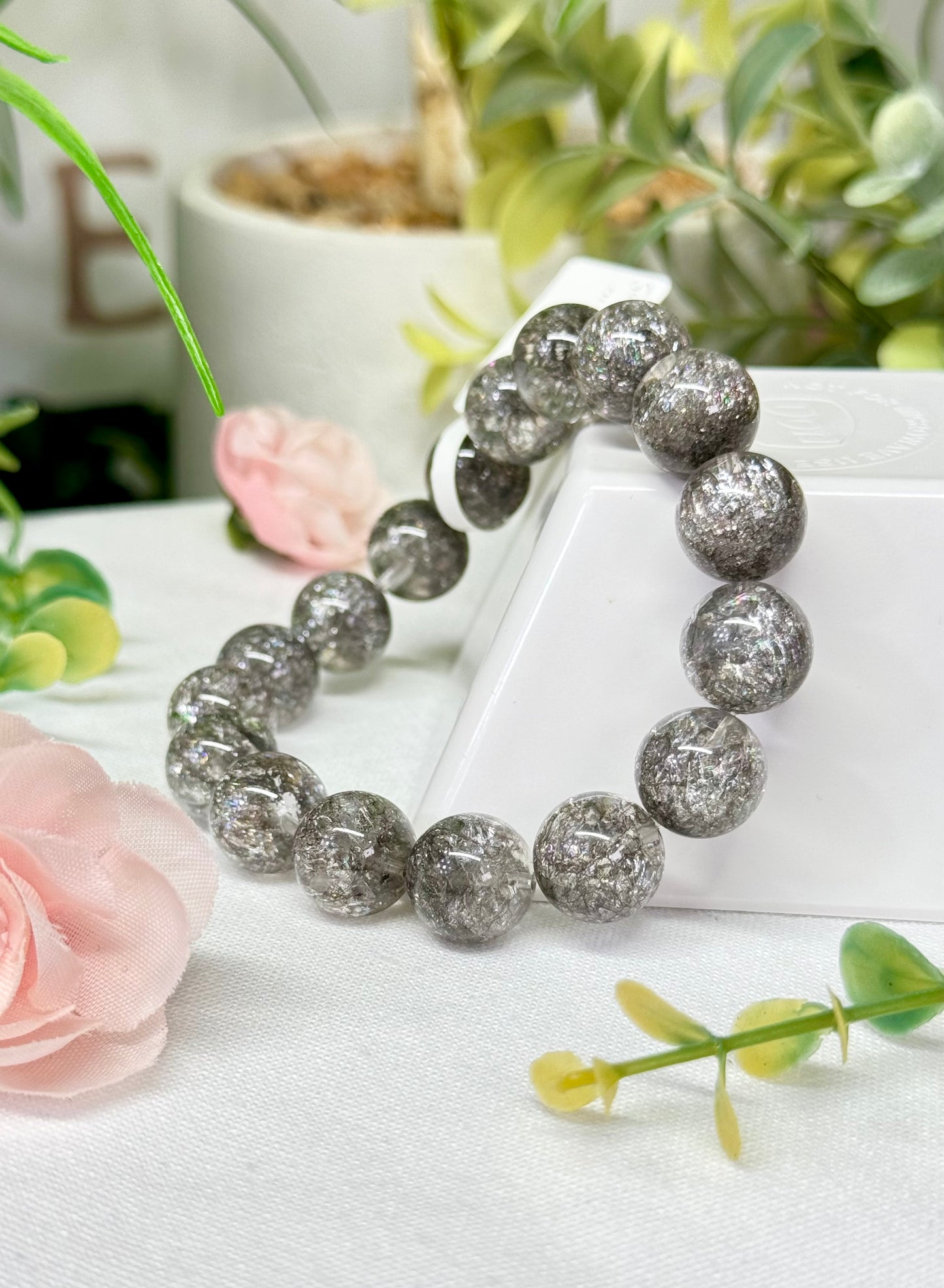 Silver quenched quartz bracelet. See photos for detailed view. *color enhanced. 12mm beads and fits wrist size 7”