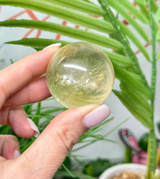 Honey calcite sphere. 40mm includes a sphere stand