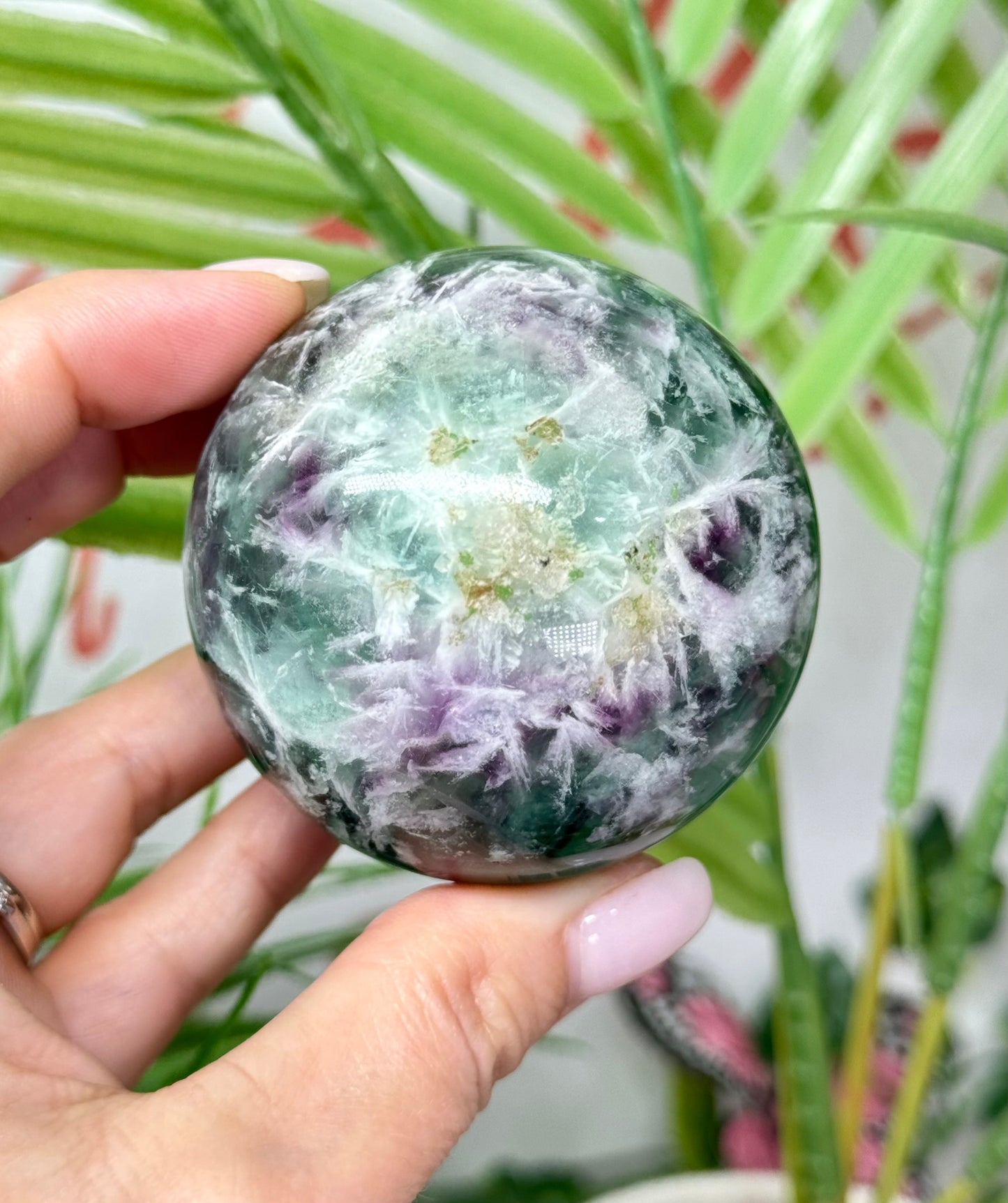 Large feather fluorite sphere. 60mm and will include a sphere stand. *see attached photos for back lighting