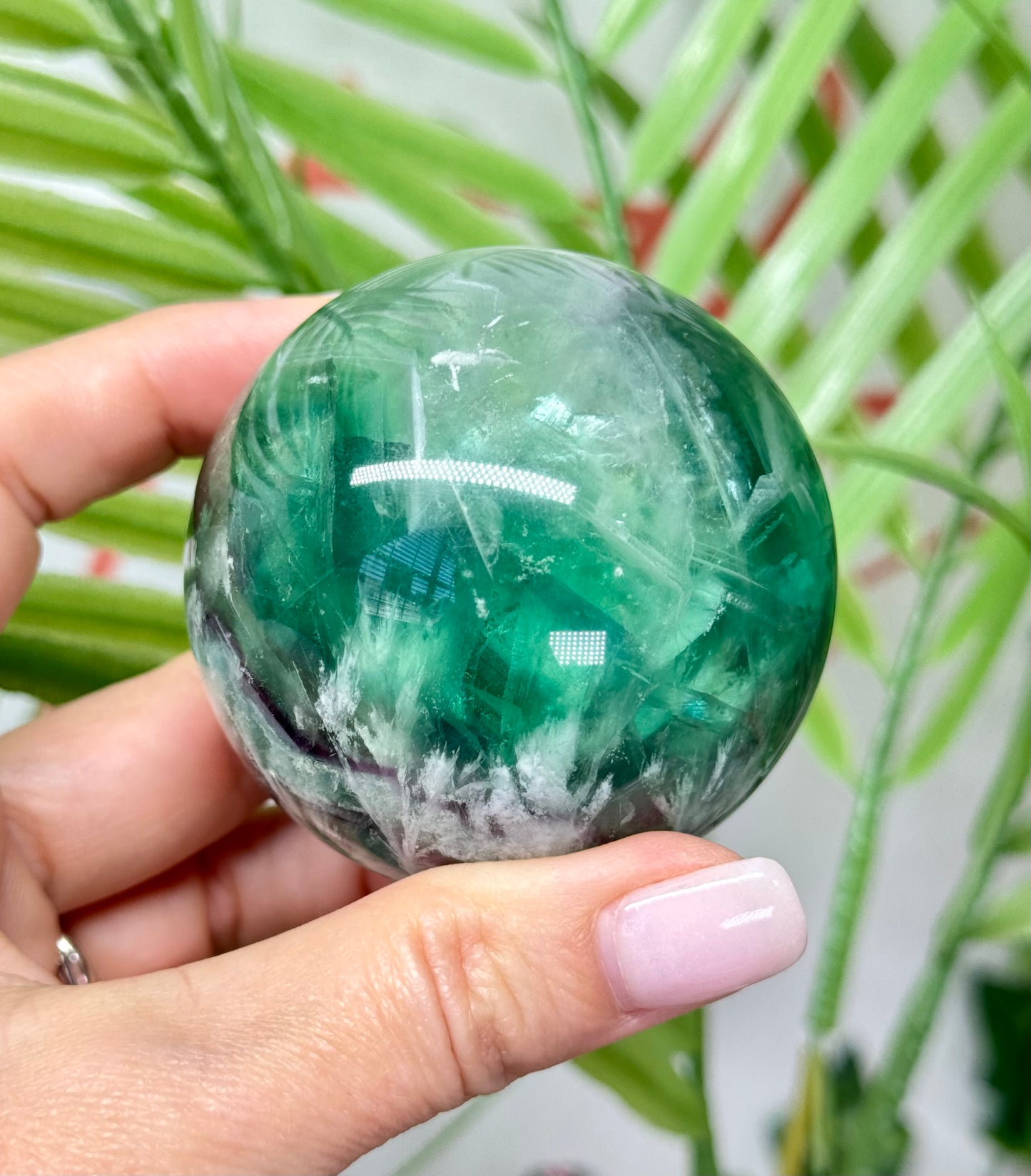 Large feather fluorite sphere. 60mm and will include a sphere stand. *see attached photos for back lighting