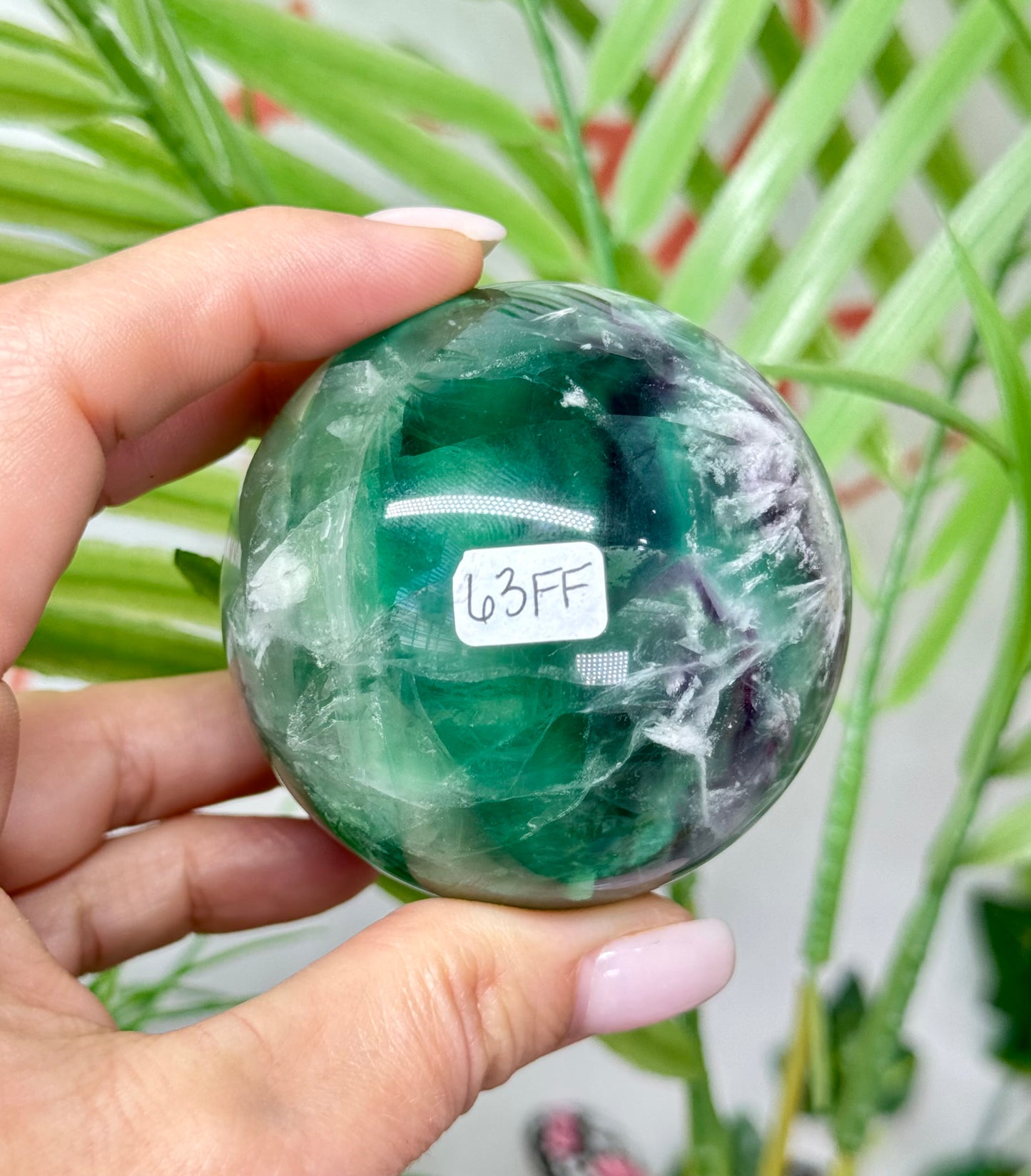 Large feather fluorite sphere. 60mm and will include a sphere stand. *see attached photos for back lighting