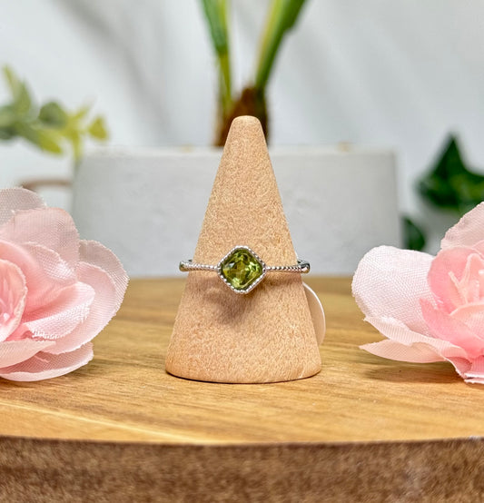 Peridot ring. Silver plated copper and adjustable to fit size 5-10