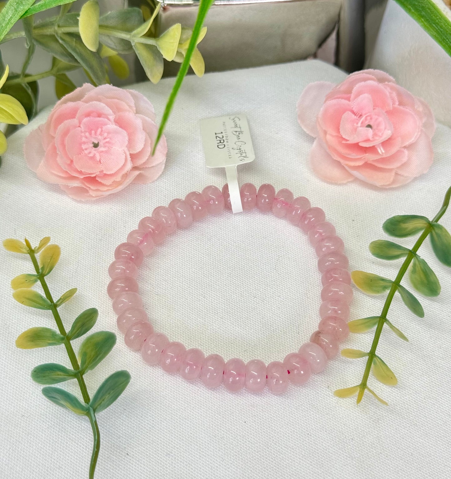 Rose Quartz donut beads bracelet. 9mm beads. Fits wrist size 7”. Can be resized, please see description