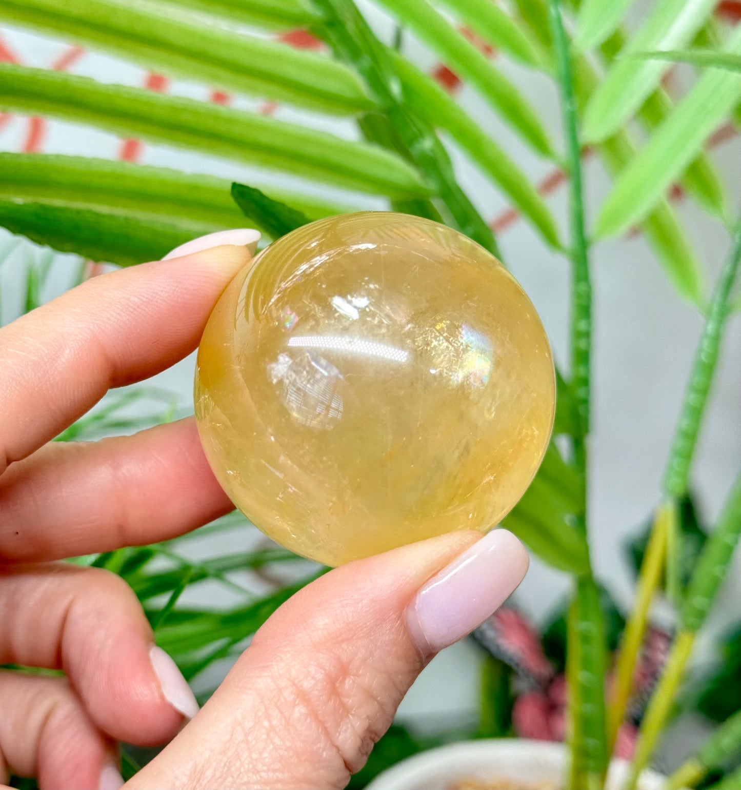 Honey calcite sphere. 44.5mm includes a spheres stand