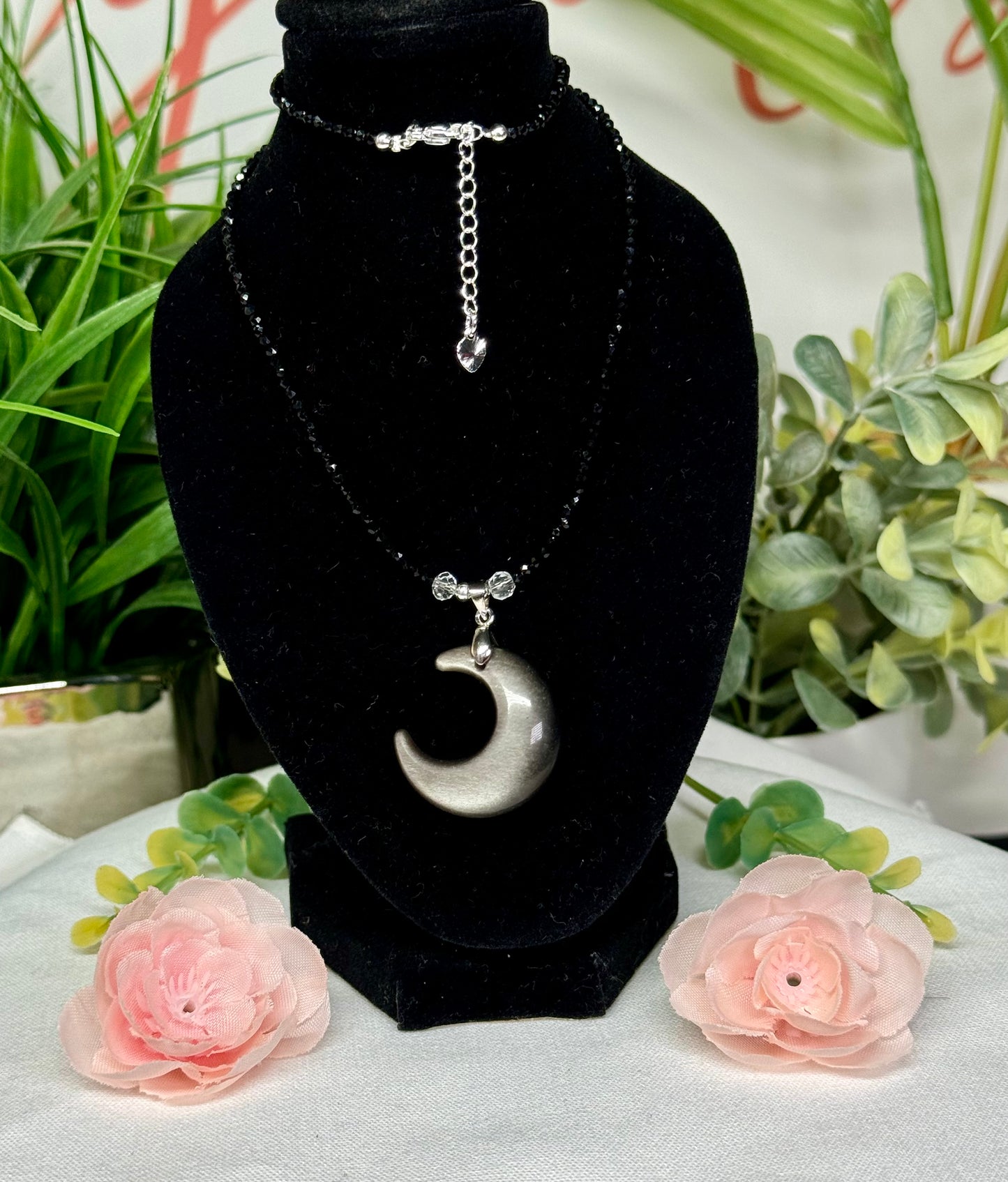 Silver sheen obsidian moon necklace. Silver plated hardware and adjustable 15.5-17” long.