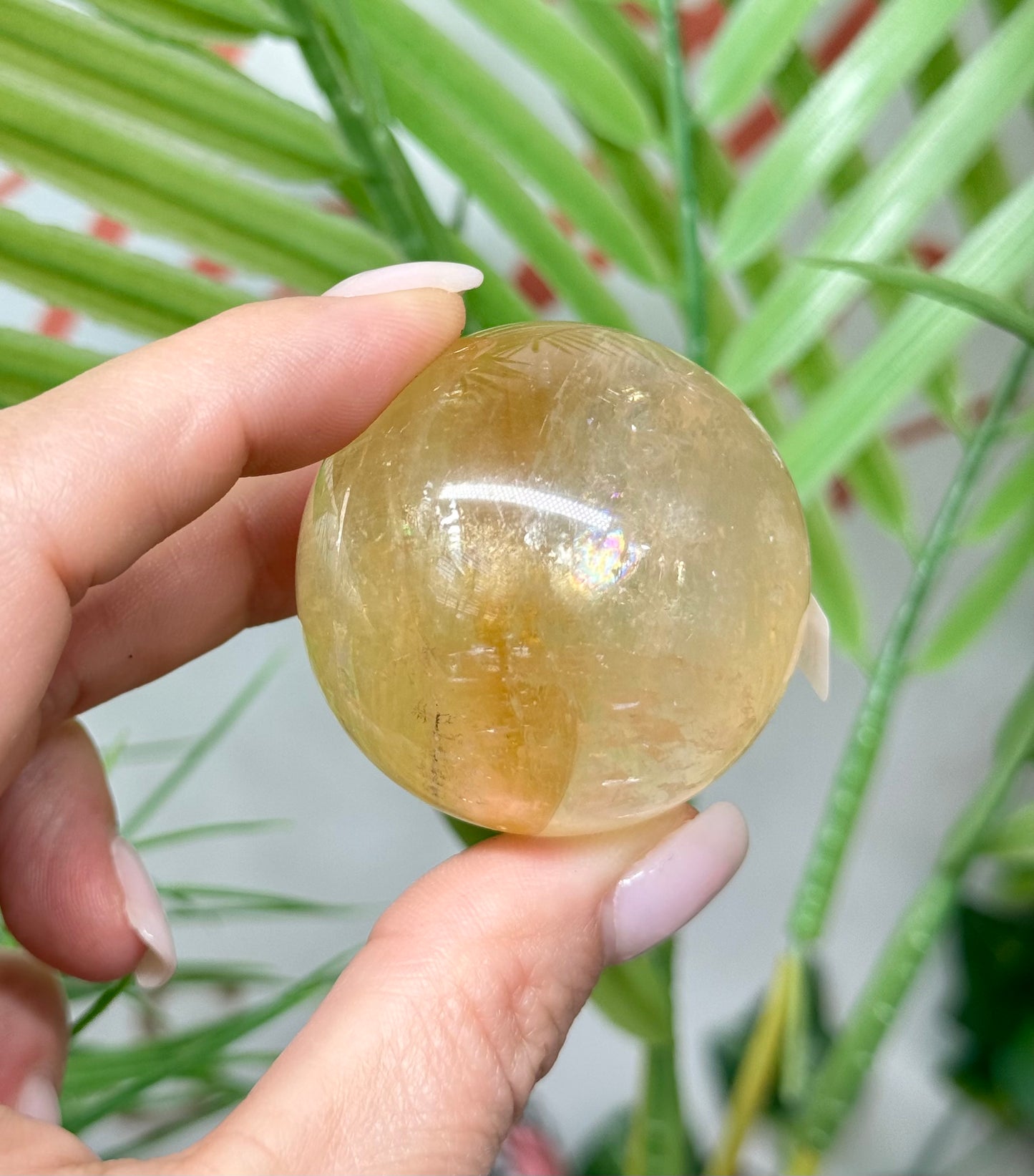 Honey calcite sphere. 42mm includes a sphere stand