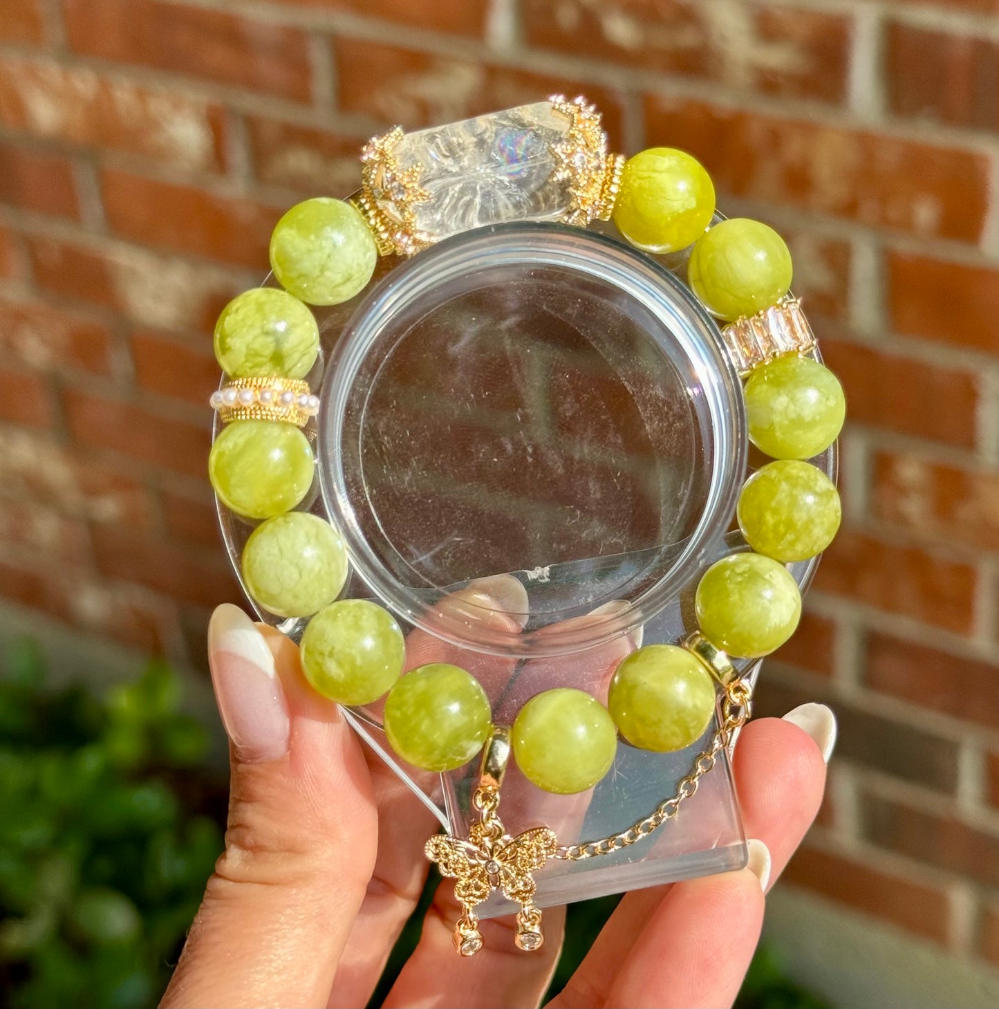 Serpentine jade design bracelet with clear quartz Freeform and butterfly chain detail. 12.3mm beads fits wrist size 6.5-6.75”