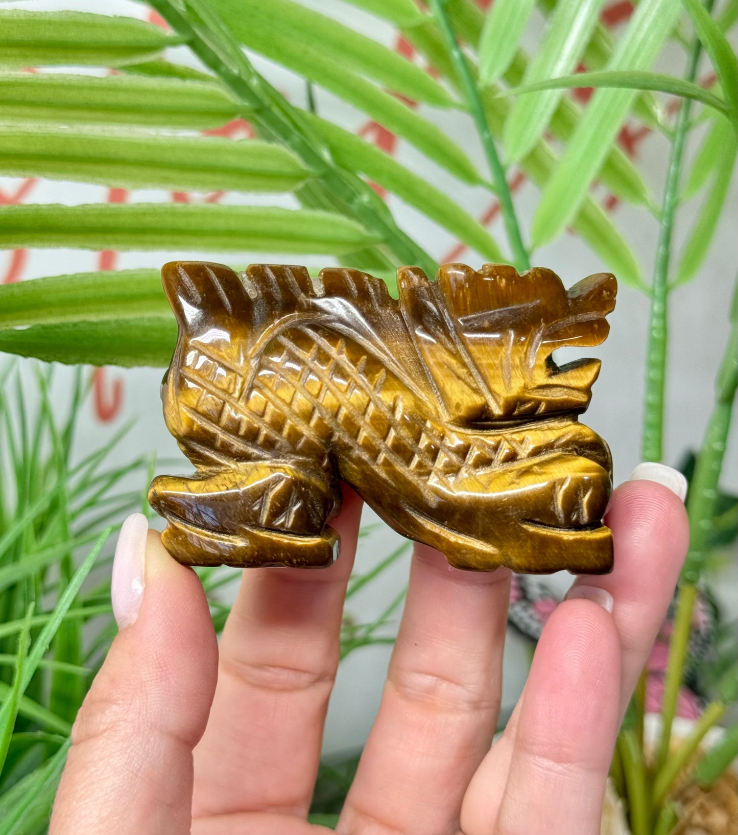 Tigers eye Chinese dragon carving. Measures 3” wide and 2” tall