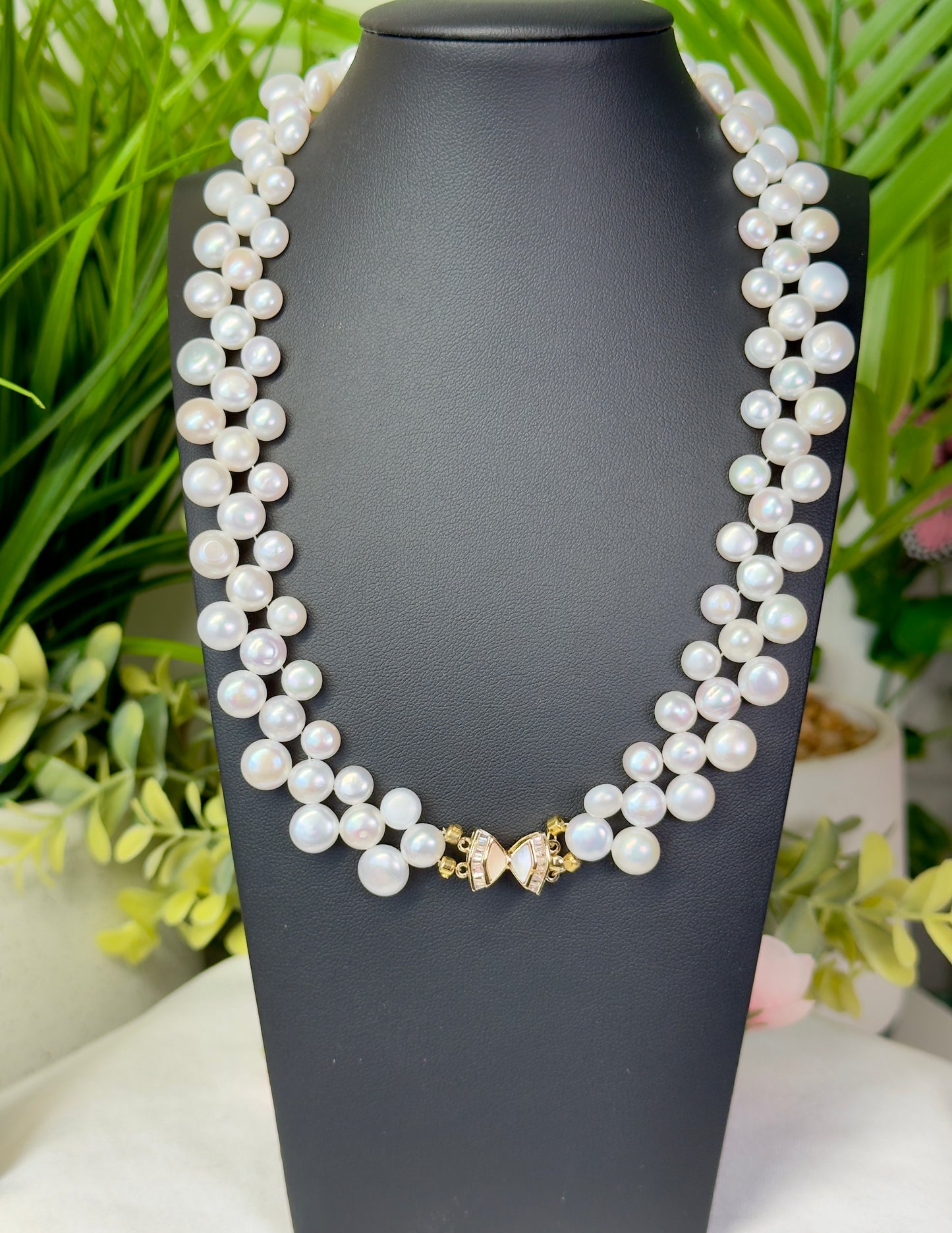 Gorgeous freshwater pearl statement necklace with 3 rows of pearls and beautiful butterfly closure. Size 17”