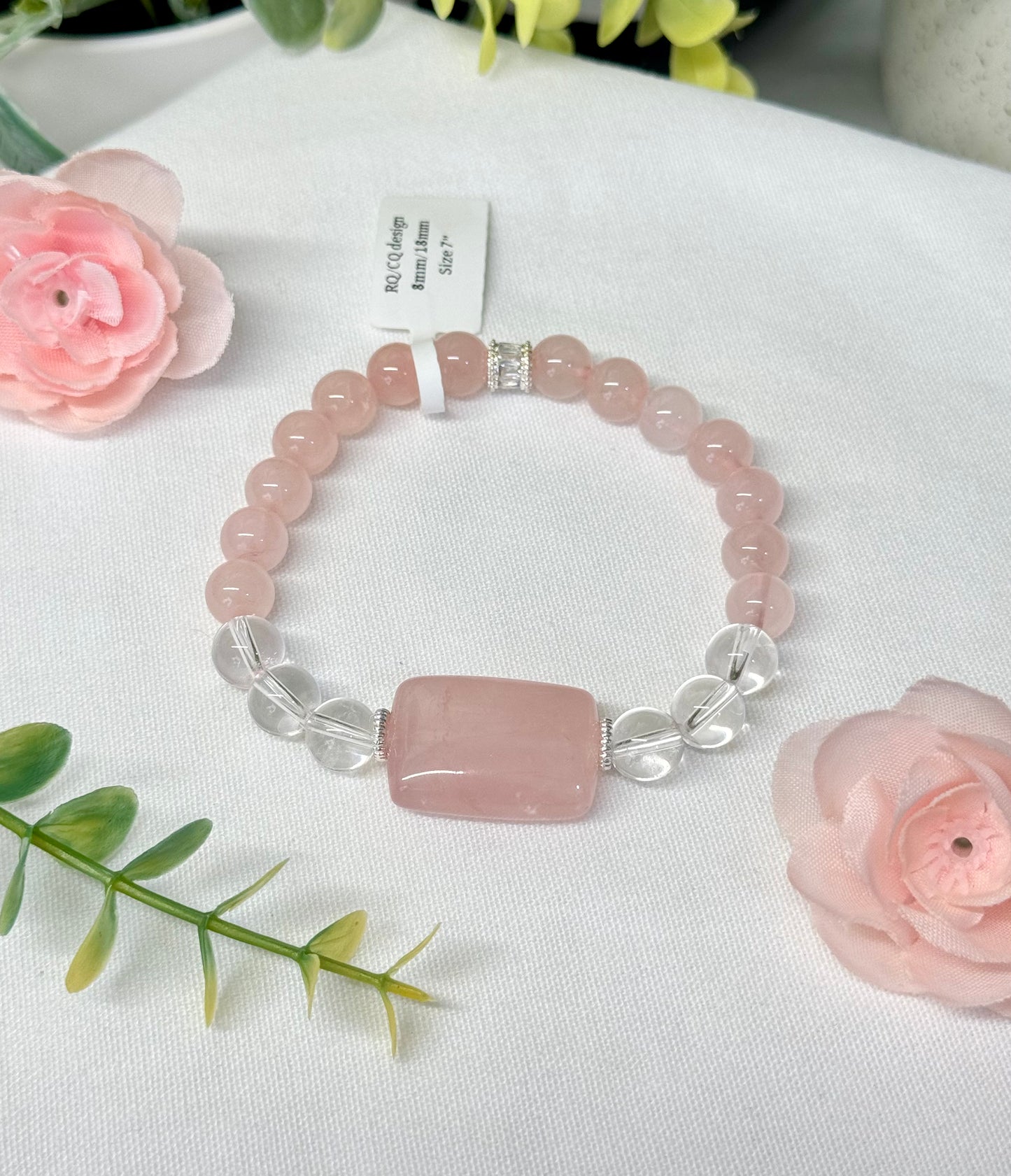 Clear Quartz bracelet with large rose quartz bead. 8mm/18mm. Size 7” and adjustable